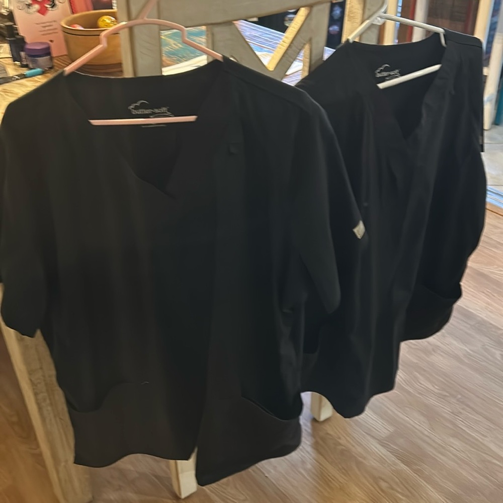 Scrub tops cost is for a set of two black scrub tops. Butter-Soft.